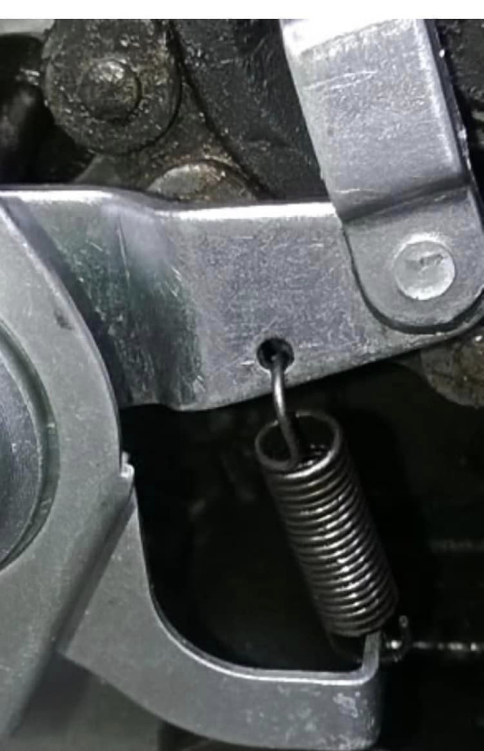 Replacing a spring connecting to the clutch cable