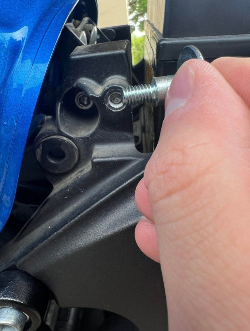 What's the best way to remove this broken bolt that holds my seat in place?