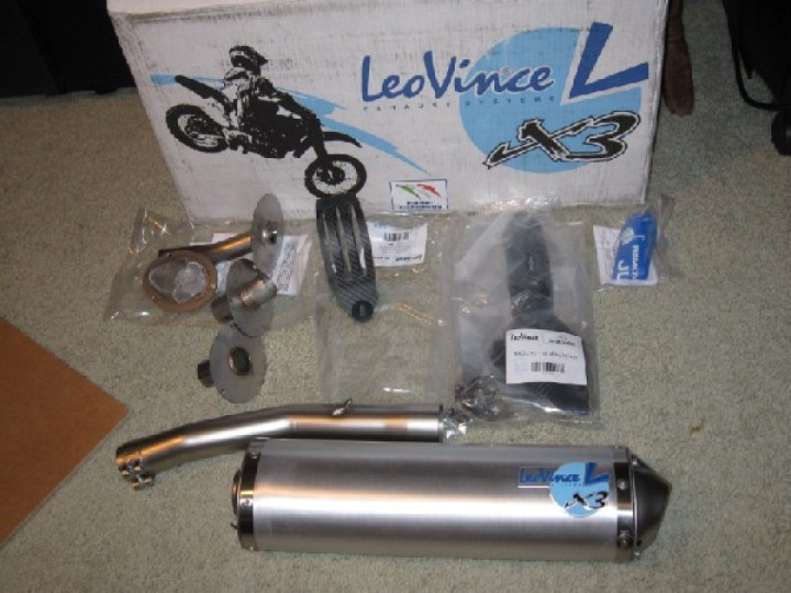 Replace stock exhaust muffler with a Leo Vince