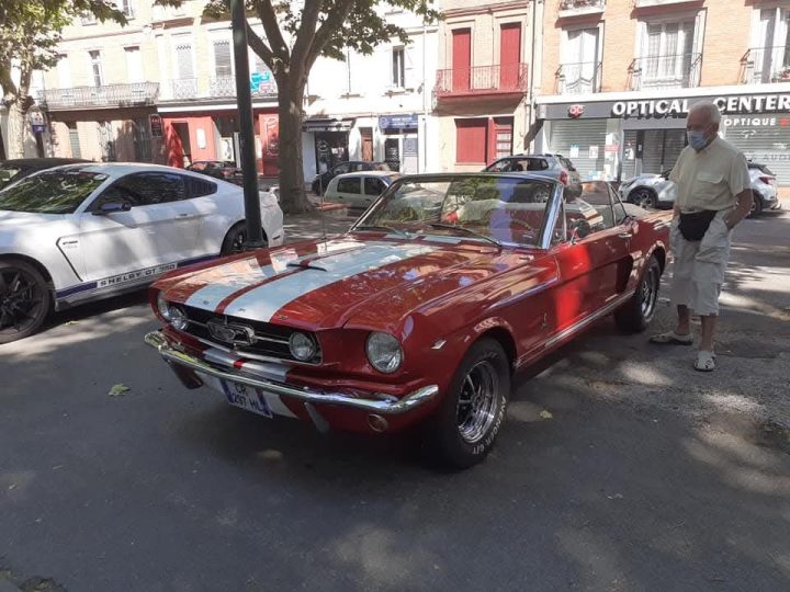 Packed with people, cars, motorcycles, and people. Have a nice day