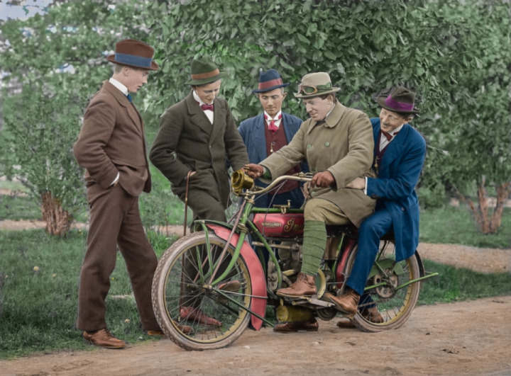 The first motorcycle in the village the 1910s, color photo.