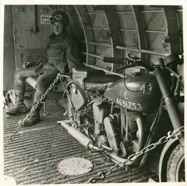 D-Day 1944, a soldier with his Matchless G3L motorcycle being airlifted into Europe in a glider