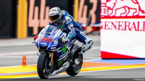 Why do MotoGP riders stick their leg out when braking