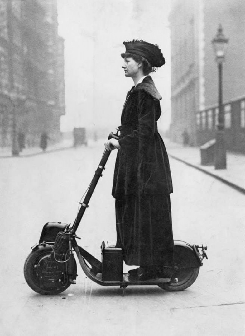 A suffragette in London on a motorised scooter, 1916.