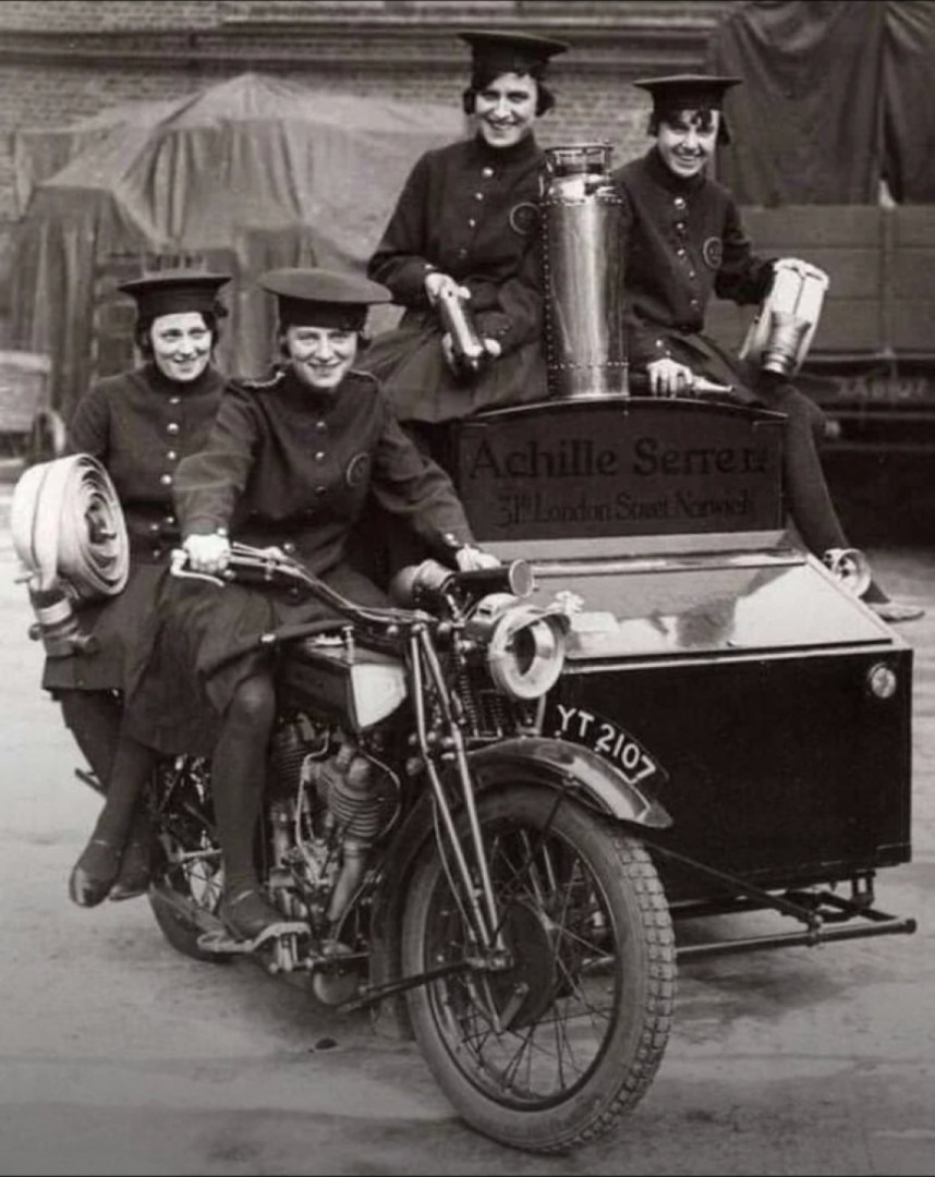 Female fire fighting team on a converted motorcycle in london, 1932