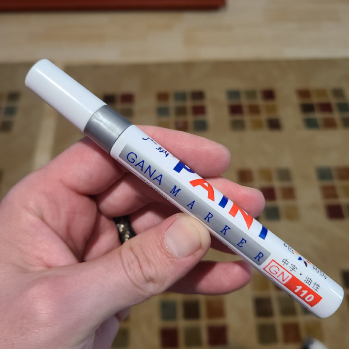 In case this is helpful to anyone this paint pen turns out to be a very close match for Shoei silver