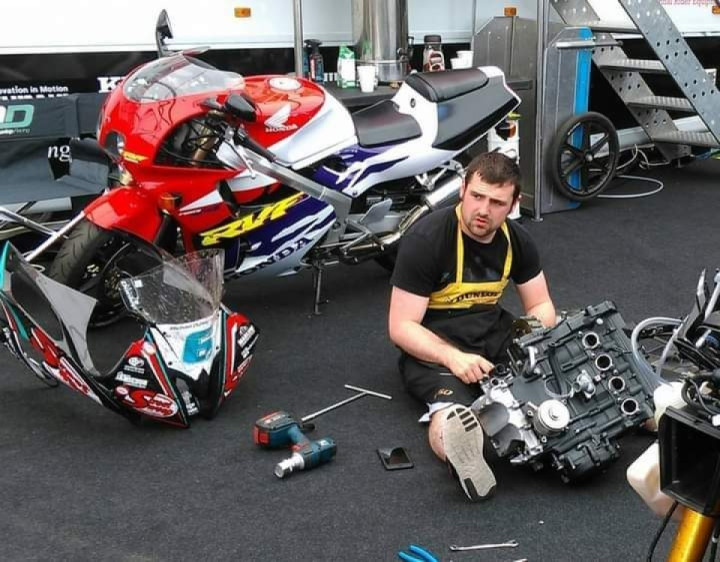 This ain't no F1 driver ... Michael Dunlop doing a bit of mechanicing in between races at the TT!