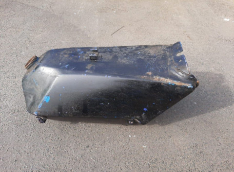 I found this old fuel tank, but could not find anything similar to it online.