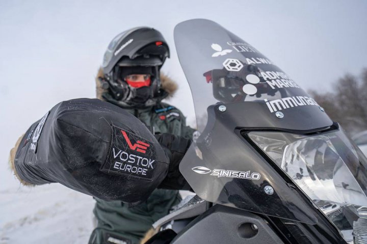 Motorcycle rider is going to the coldest place on Earth