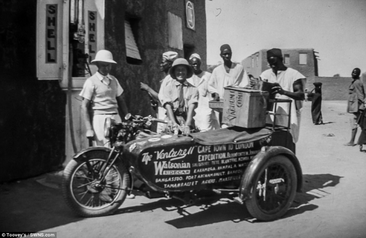 Florence Blenkiron can be seen posing behind the duo's motorbike. Written on the sidecar are the words: 'Cape Town to London Expedition'