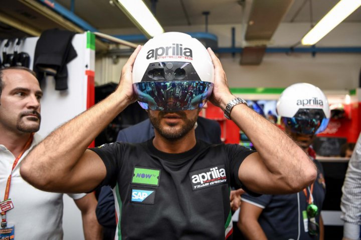 Mechanics from the team Gresini Aprilia use helmets  augmented reality
