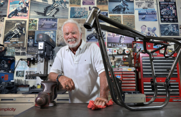 Motorcycle frame builder Jeff Cole, 76, in his home garage workshop with his Honda NS750 frame design, which is prized by collectors around the world.