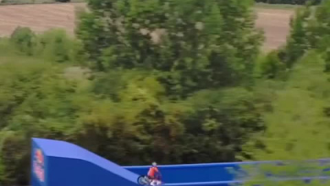 German motocross rider Luc Ackermann did a backflip over a road sign and landed on moving trucks.