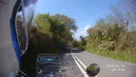 On a '2 ferries' ride, a meteor 350, heads down the valley to Kingswear higher ferry.
