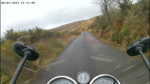 Royal enfield interceptor 650cc enjoying the climb from Hexworthy to Combestone Tor.