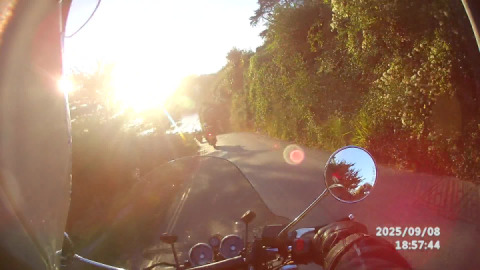 On a glorious autumn evening, Plymouth advanced motorcyclists pass through Seaton, Cornwall.