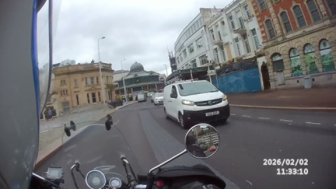 Royal enfield meteor 350, cruising along Torquay Harbour side.