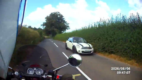 Enjoying a national speed limit country road, and perfecting my safe positioning & ..