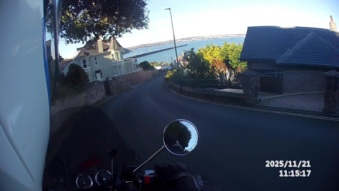 My Interceptor 650 rounds a corner to be treated to beautiful views of Brixham Breakwater & Torbay.