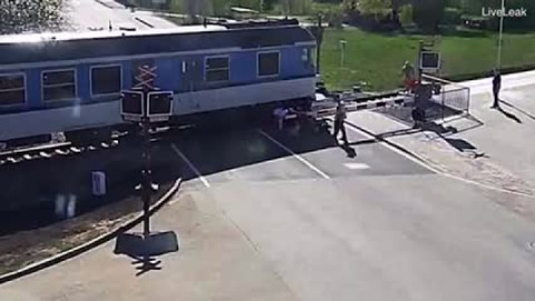 Motorcycle rider doesn't see lowered boom at a rail crossing