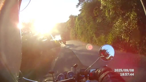 On a glorious autumn evening, Plymouth advanced motorcyclists pass through Seaton, Cornwall.