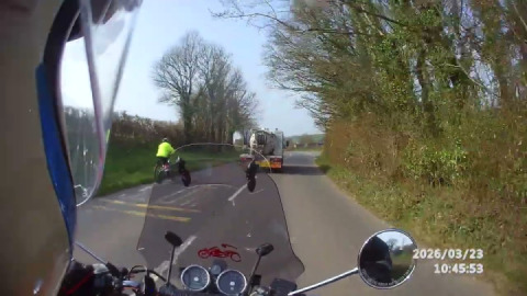 Exercising patience and caution whilst waiting for a safe opportunity to pass a slow moving truck.