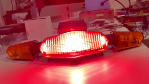 Improved tail lamp with LED standing lights on the side and independent brake light.